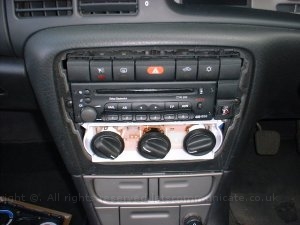 Dashmounsatnavbracketstep2remove.jpg - To fit the dashmount.co.uk bracket on a Vectra B remove the silver surround and slip the backet under the top of the dash and refit the surround. Its worth noting when using the phone version of the bracket you remove the screw next to the radio but I also found you had to grind some of the plastic away as well..... this is totally invisable when put back together