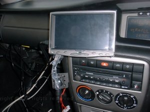 v2wiringshot3.jpg - Here you can see the screen been fitted with all the cables been routed over the top of the glove box and then in. This gave a neat apprence but still made the bullet connection easy to access to remove the screen at night