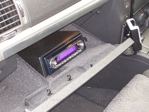 iceinstalledinglovebox1.jpg - Here you can see a shot of the din adaptor and my head unit ( the old Kenwood ). I did buy a new Blaupunkt unit with a Canbus adaptor how ever it seems even though its sposed to be it was not compatible with my car. This caused several weeks ( long story ) of delays and was one of the main reasons I missed the 2008 Digital-car show. I will revisit this situation at some point