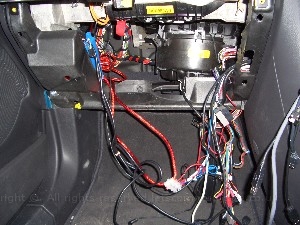 inthemiddleoftheinstall2.jpg - The CPU was fitted in the boot ( see the CPU gallery ) and all the cables lead down the drivers side, over the peddels ( in case of an accident ) and behind the dash