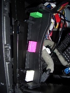 v5irlightsensorfit1.jpg - To install the IR / Light sensor I had to create some space for the cable. There was a plastic holder which was removable for some of the incar wiring. I simpley removed it, then using a dremel created a channel for the cable and then refitted with the cabel already passed through. Once the moddified blanker was replaced it gave an OEM feel although this was not the initial design I was happy with it