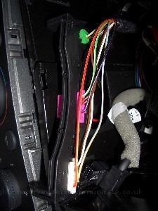 v5irlightsensorfit2.jpg - To install the IR / Light sensor I had to create some space for the cable. There was a plastic holder which was removable for some of the incar wiring. I simpley removed it, then using a dremel created a channel for the cable and then refitted with the cabel already passed through. Once the moddified blanker was replaced it gave an OEM feel although this was not the initial design I was happy with it