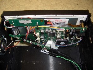 doubledinscreenbuild19.jpg - In the end this is how it looked. Using a number of diffrent items from cables ties, 3m hooks and a bit of silacone ( for the speaker ) and some mother board mounts I finally fitted it all together. I had to make sure no board touched another and that they where supported well. The trailing cables are for the screen connection and the IR / Light sensors. Here you can see a close up